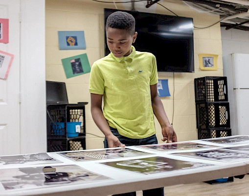 One of our Art Afternoon's students viewing the work of photographer Michael McCoy. (Photo Credit: Michael McCoy)